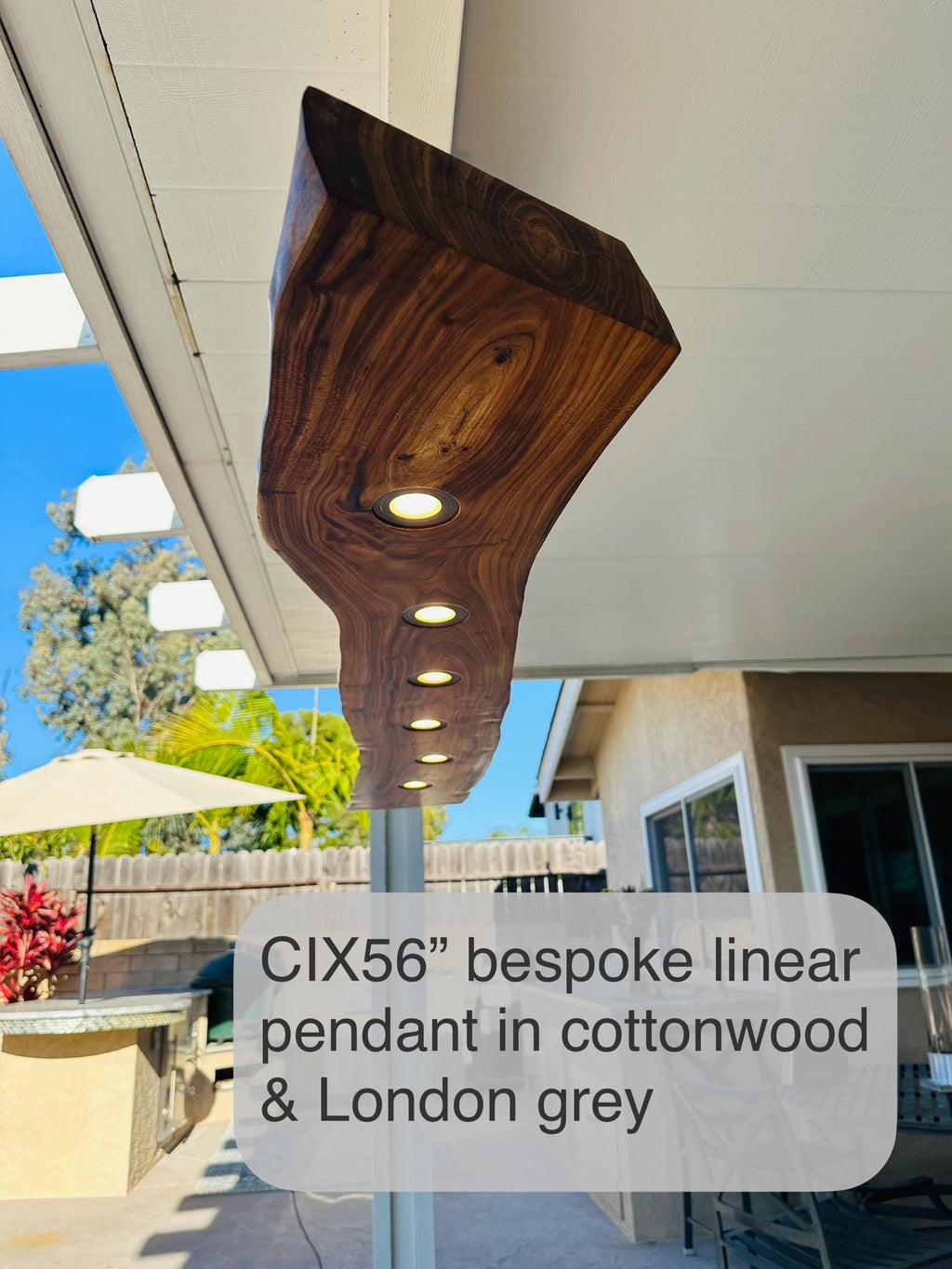 CIX LIVE EDGE linear pendant chandelier in black walnut and brushed aluminum
